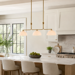 Enzo 60-Inch Three-Light Linear Chandelier — Heritage Brass / Cased White 12